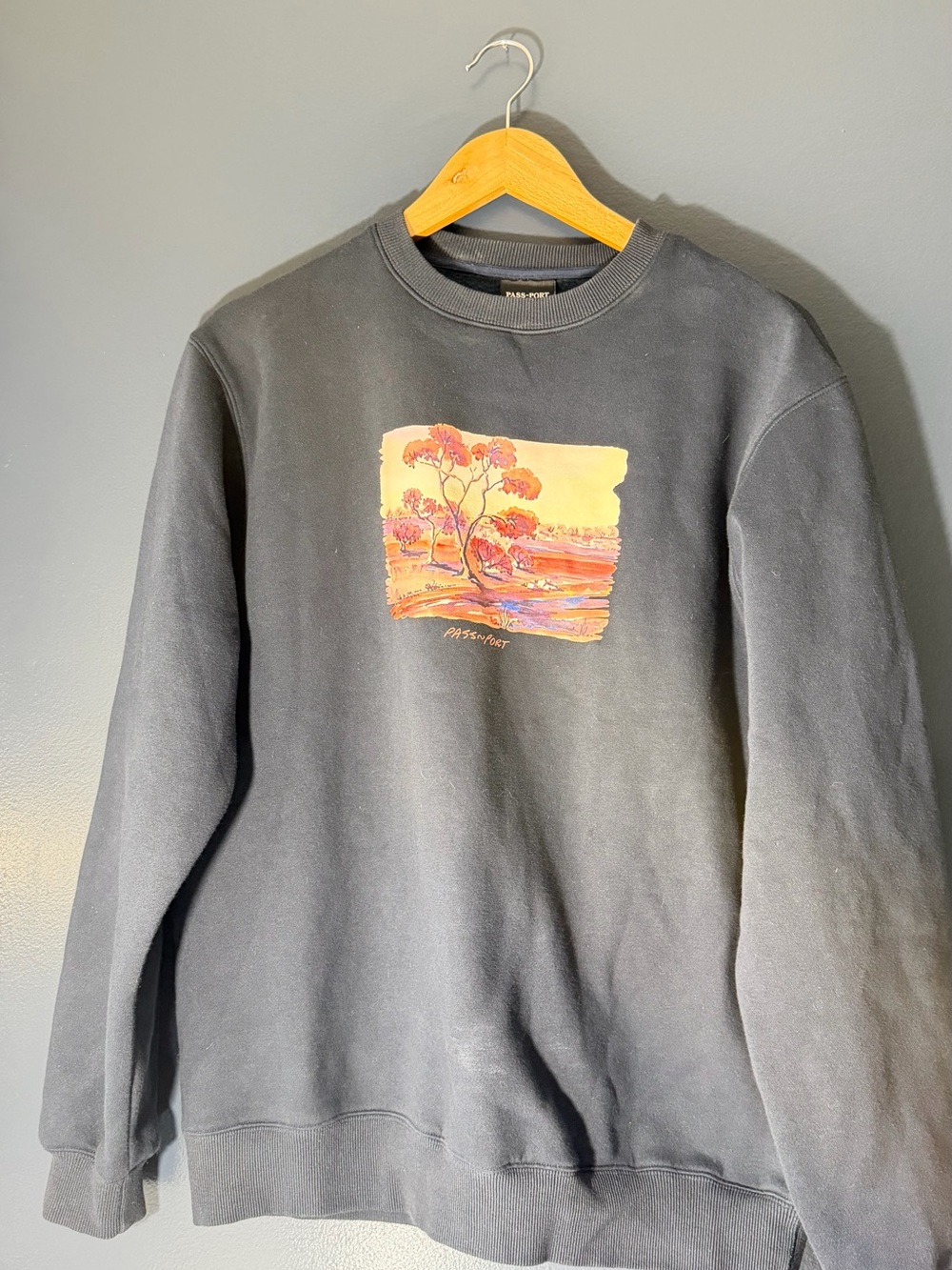 Passport Black Crewneck Sweatshirt with Warm Scenic Graphic